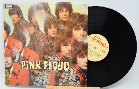 Vinyl record with Pink Floyd album cover featuring band members and EMI logo.