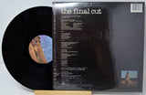 Vinyl record with cover displaying text and images on a light gray background