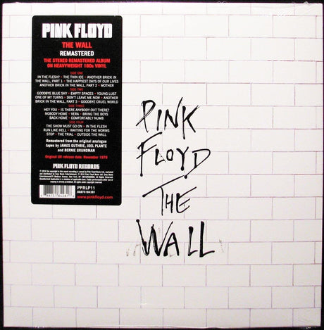 A vinyl record of Pink Floyd - The Wall with a white background and black text including the album title and band name.