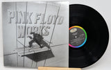 Vinyl record with cover featuring a man by a waterfront, 'Eric Clapton' album text.