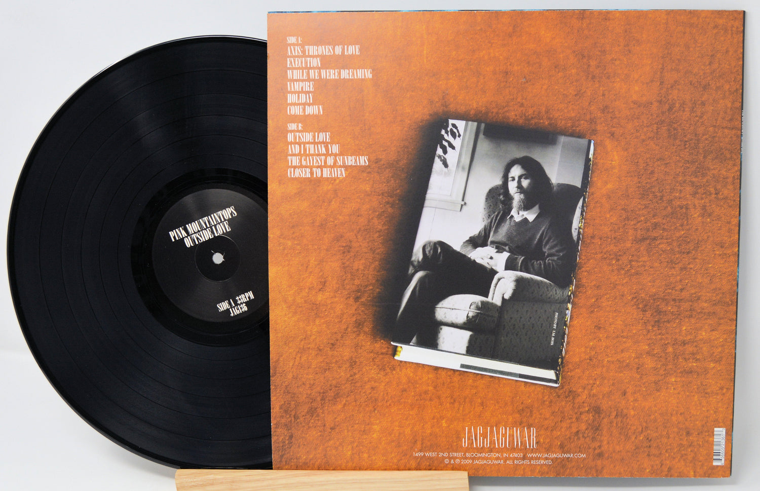 Back cover of Pink Mountaintops' Outside Love vinyl LP showing tracklist and an artist photo