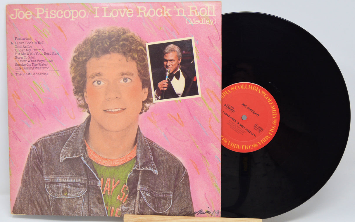 Vinyl record with cover featuring a person and text 'I Love Rock 'n Roll'.