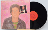 Vinyl record with cover featuring a person and text 'I Love Rock 'n Roll'.