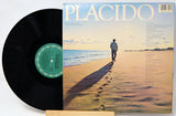 Vinyl record with a cover featuring a person walking on a beach