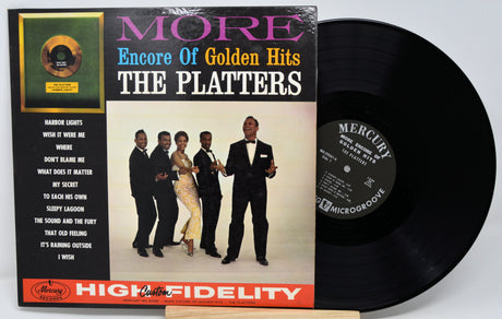 Vinyl record with cover featuring The Platters and text 'More Encore of Golden Hits'.