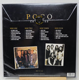 Back cover of a Poco Covered 41st Anniversary vinyl record LP in shrink wrap, showing track listings for four sides and two band photos on a black background.