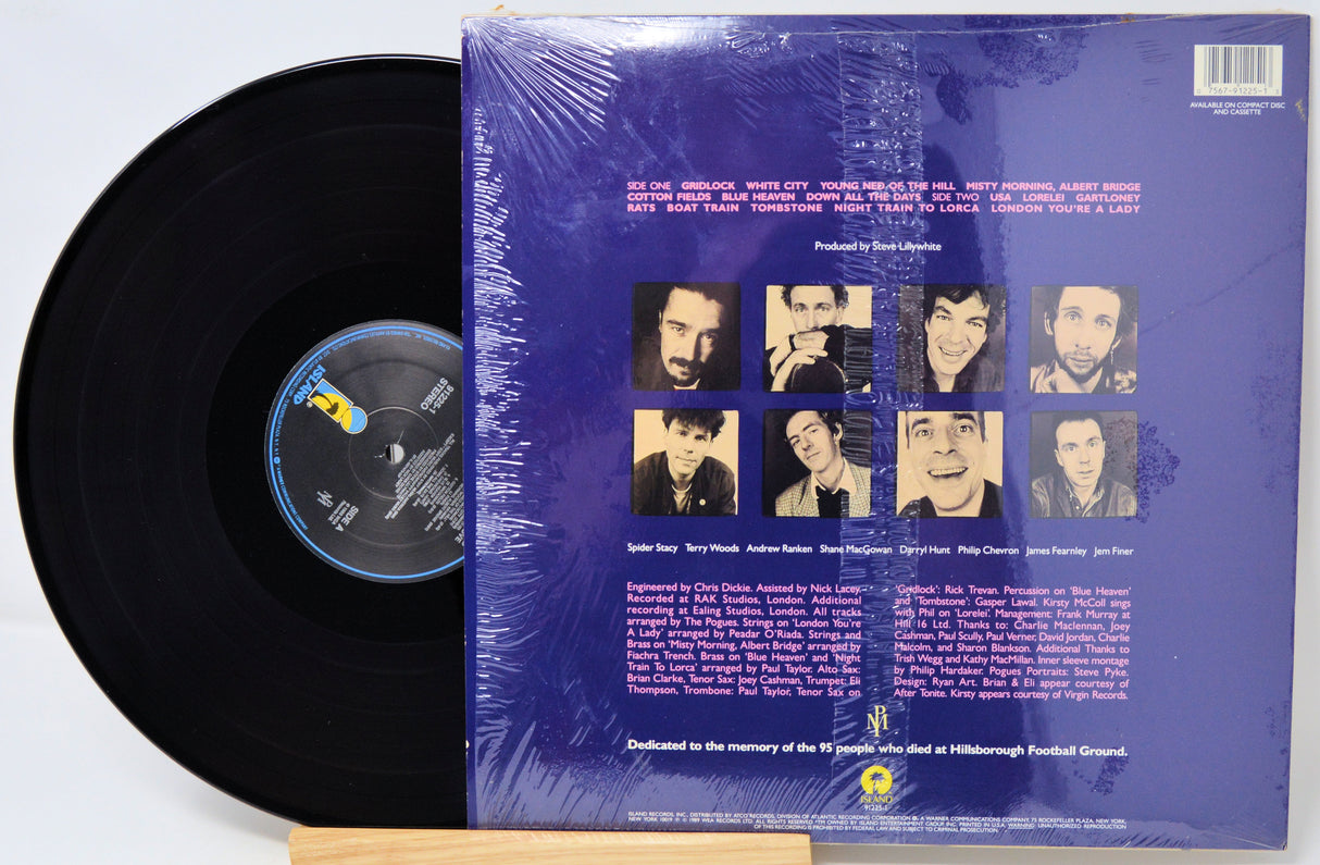 Vinyl record with a blue cover featuring album artwork and text.