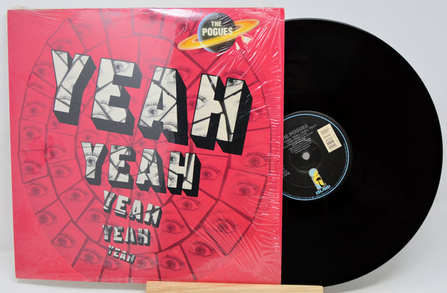 Vinyl record with a red cover featuring 'Yeah Yeah Yeahs' text and The Pogues logo.