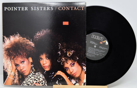 Vinyl record with 'Pointer Sisters' album cover showing three women.