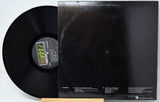 Black vinyl record with a visible label and matching black record cover on a white background