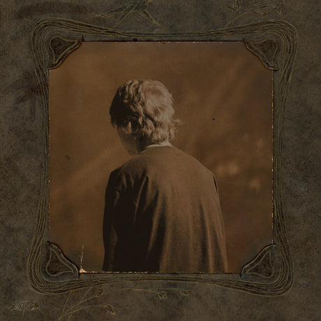 Sepia-toned album cover featuring a person with their back turned, surrounded by ornate vintage framing
