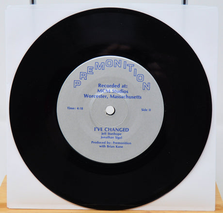 Vinyl record with a white label on a white background featuing I've changed