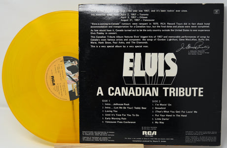 Yellow vinyl record with black cover featuring 'Elvis: A Canadian Tribute' text