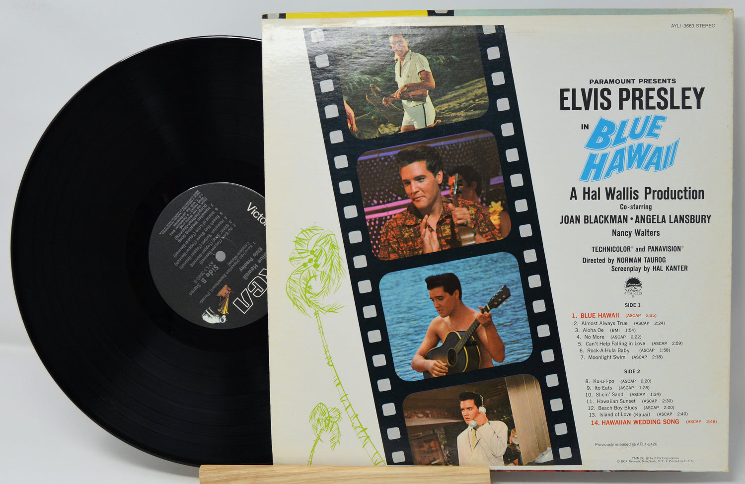 Vinyl record with a 'Blue Hawaii' movie poster design on the cover