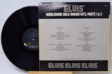Vinyl record with 'Elvis' Worldwide Gold Award Hits, Parts 1 & 2' cover on a light gray background