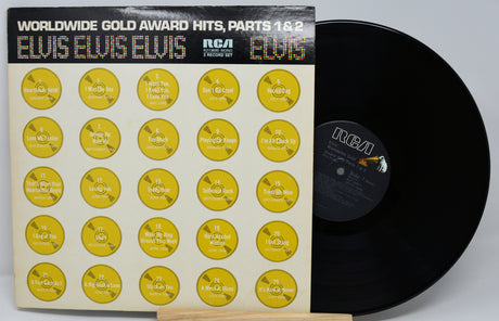 Vinyl record with yellow label design and 'Elvis' branding on a gray background
