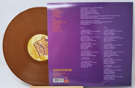 Brown vinyl record with purple label on a white background