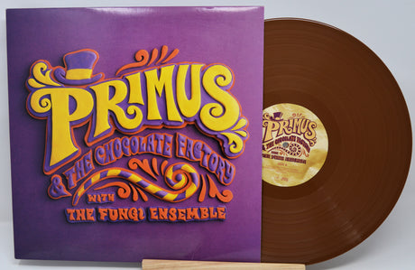 Vinyl record with a colorful cover featuring the band Primus and text.