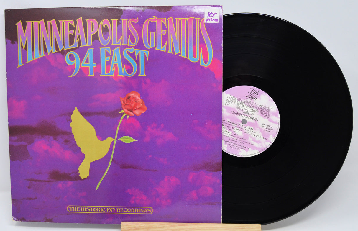 Vinyl record with a colorful cover featuring a bird and rose, titled 'Minneapolis Genius 94 East'.