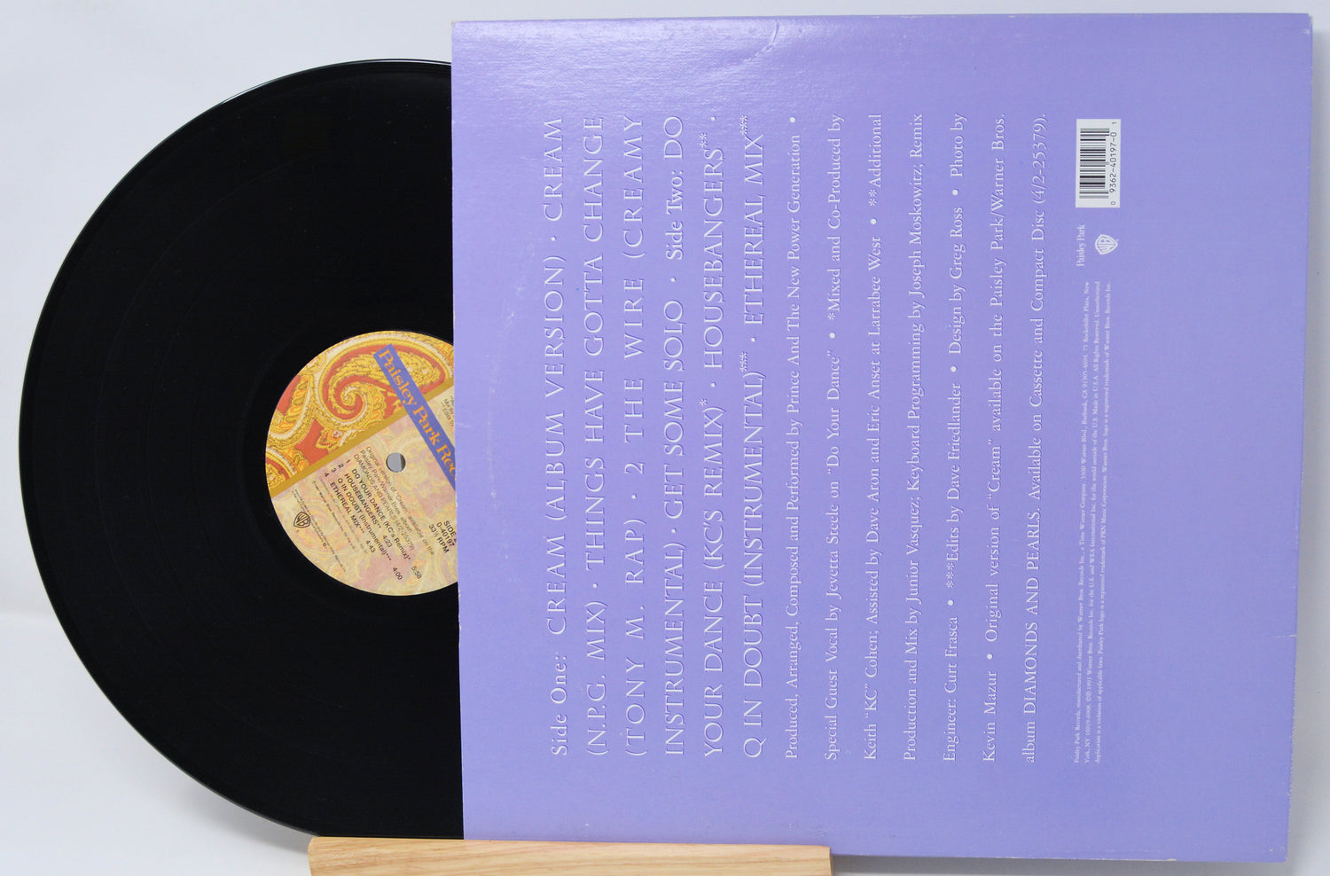 Vinyl record with a purple cover on a white background