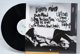 Vinyl record 'Prince - Dirty Mind' with back cover featuring a black and white image of him and text.
