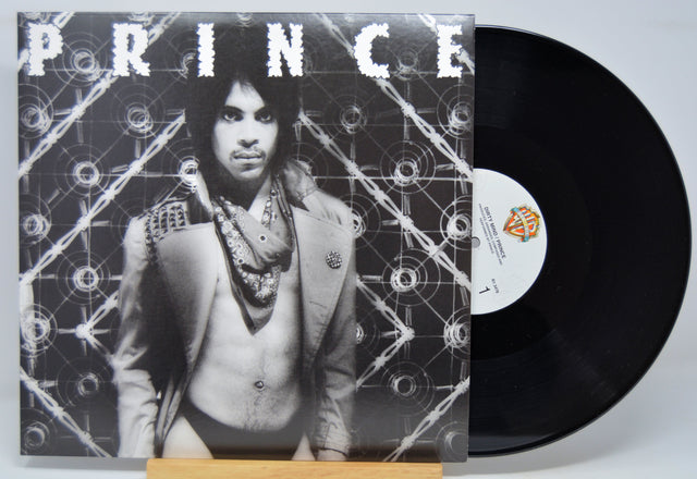 Vinyl record with a cover featuring a person and the word 'PRINCE'.