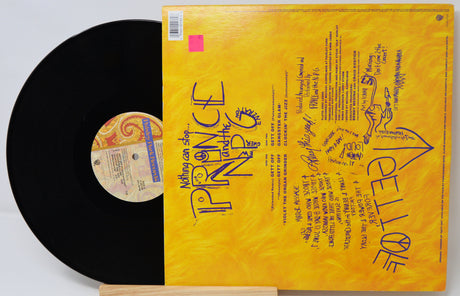 Vinyl record with yellow cover featuring text and graphics, on a white background
