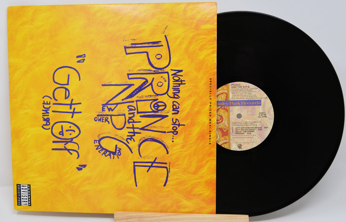 Vinyl record with a yellow cover featuring text and a black record on a white background