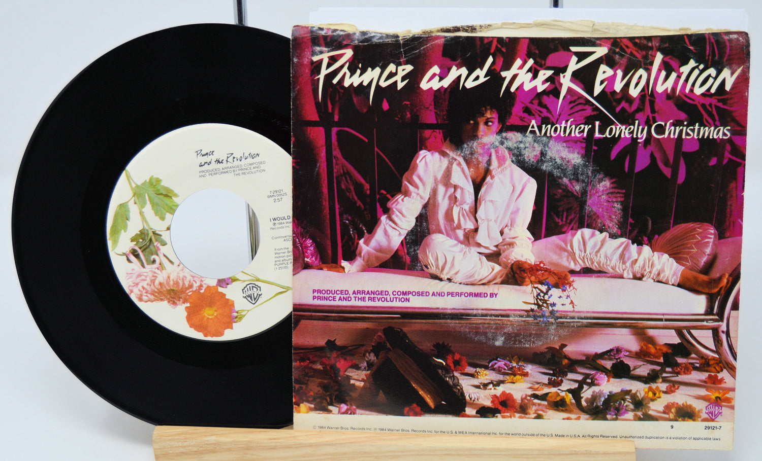 Vinyl record and cover of 'Another Lonely Christmas' by Prince and the Revolution.