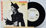 Vinyl record and cover of 'Mountains' by Prince and the Revolution on a white background