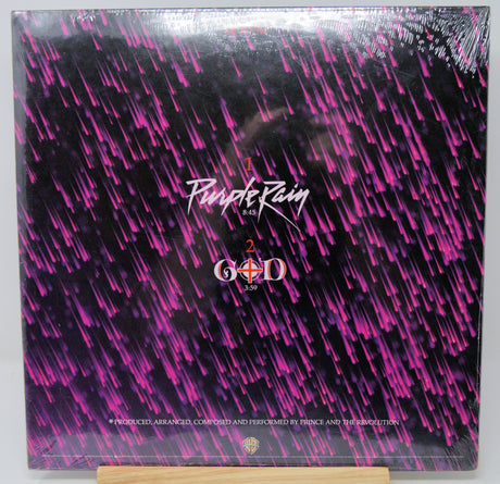 Vinyl record cover with purple rain and G.O.D text on a black background