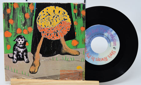 Vinyl record with a colorful cover featuring a dog and a brain, on a white background.