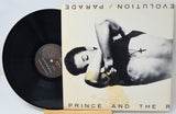 Parade album front cover featuring Prince and The Revolution with vinyl partially visible