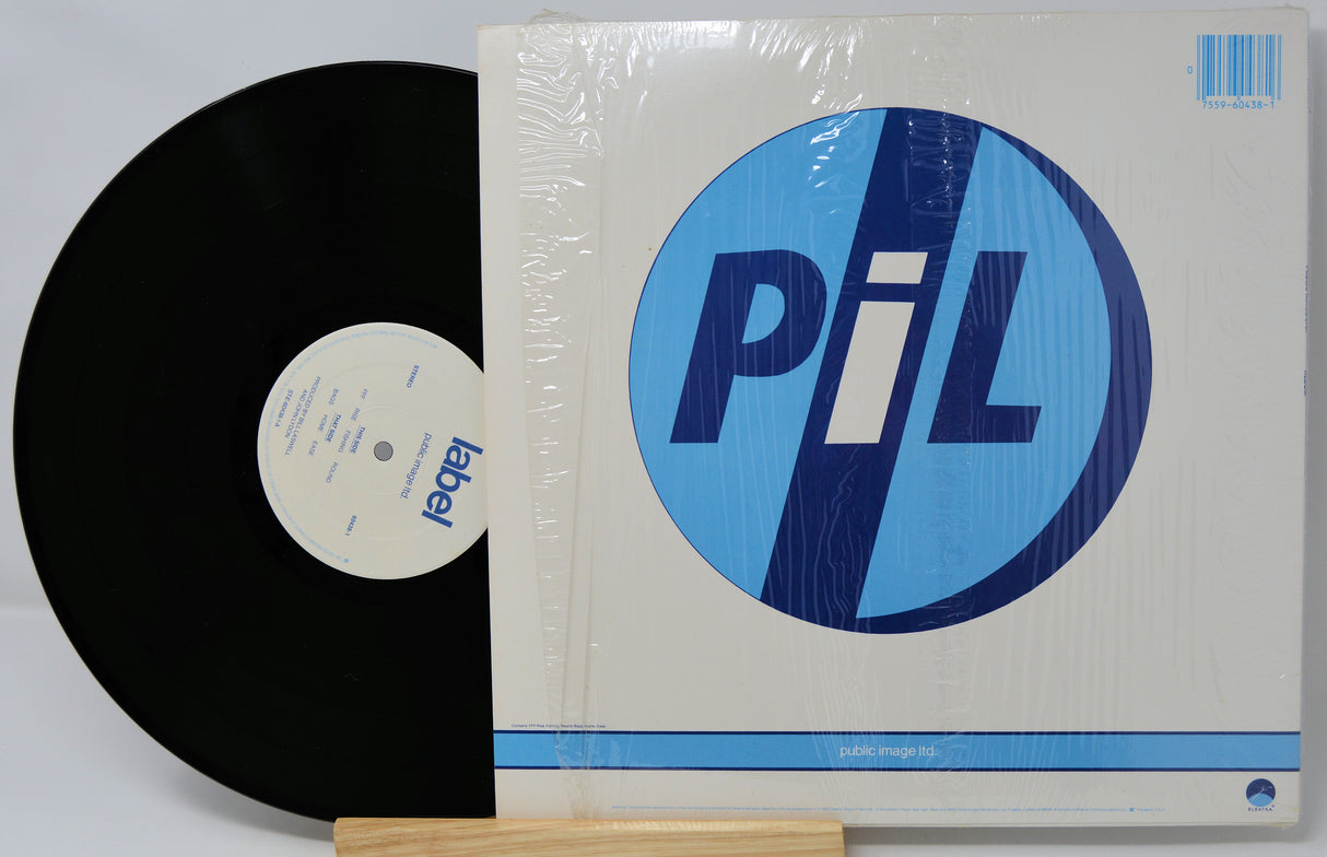 Vinyl record and its cover with a blue and white logo on a light gray background