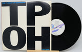 Vinyl record with 'The Pursuit of Happiness' cover and 'LOVE JUNK' label.