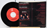 Vinyl record with red label and black cover featuring Queen on a white background