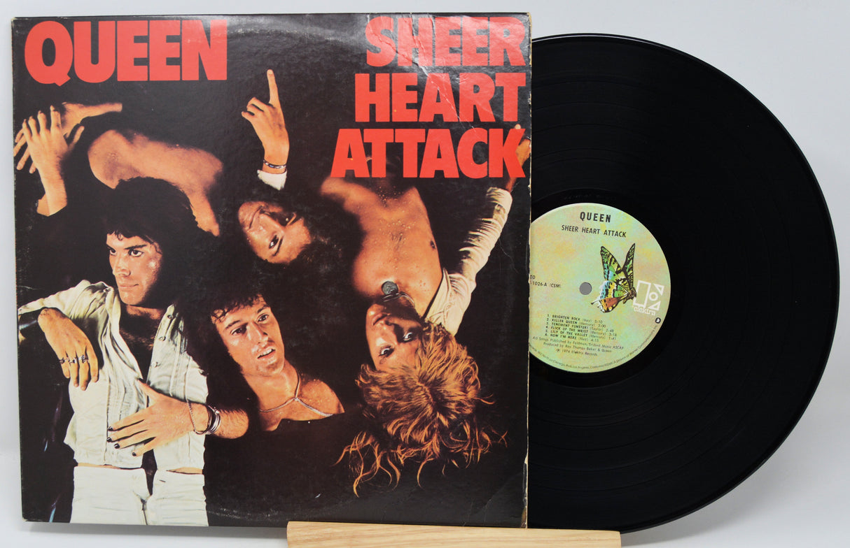 Vinyl record with 'Sheer Heart Attack' by Queen on a white background