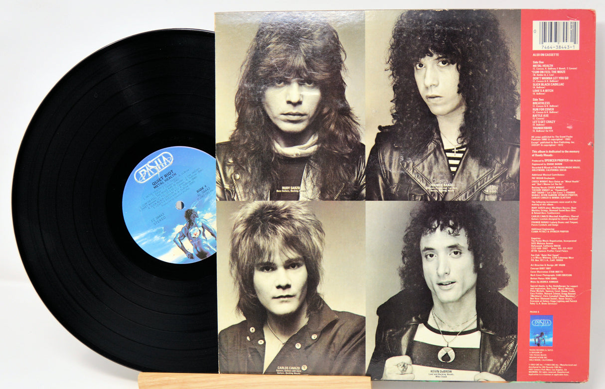Vinyl record with a cover featuring black and white portraits of a band member.