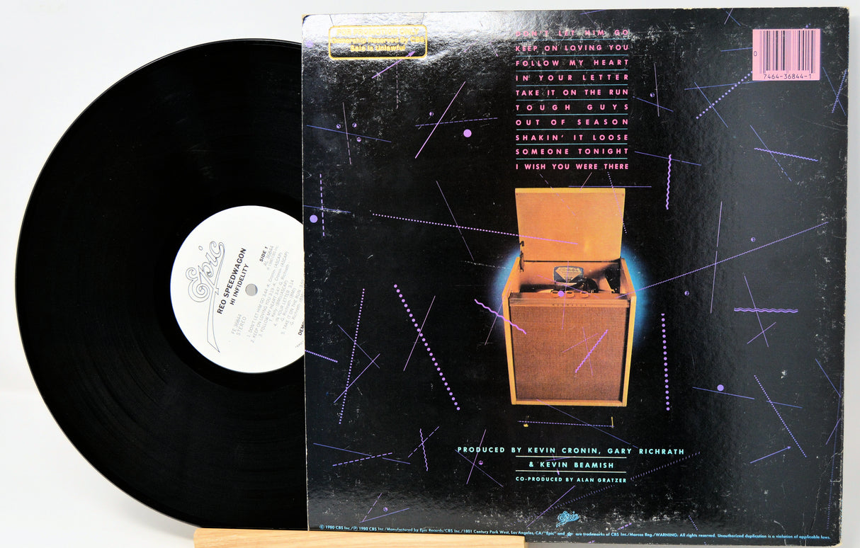 Vinyl record with its cover featuring text and a starry design.