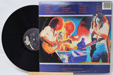 Vinyl record with colorful cover featuring musicians and text