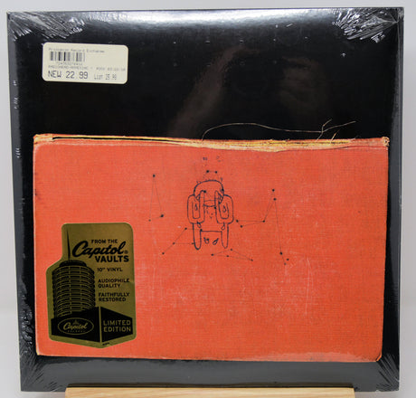 A sealed 12-inch vinyl record sleeve from Capitol Vaults, showing the orange front cover with a small black line drawing and a green Capitol logo sticker, inside a black outer sleeve wrapped in plastic.