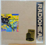 Radiohead 'drill' 6660 limited edition vinyl record sleeve, showing the beige cardboard outer jacket with a colorful album art insert, a vertical black 'RADIOHEAD' logo strip, and a gold Capitol Vaults Limited Edition sticker.