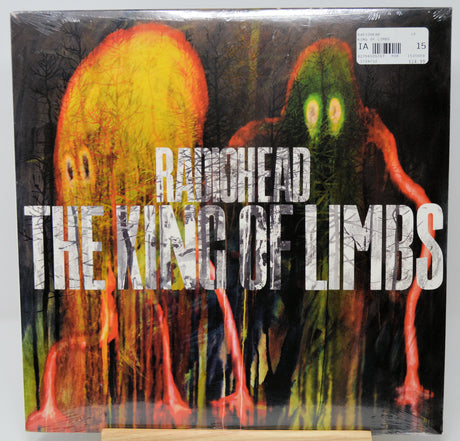 Radiohead's 'The King of Limbs' vinyl record cover, sealed in plastic with a barcode sticker in the top right, photographed against a light gray background.