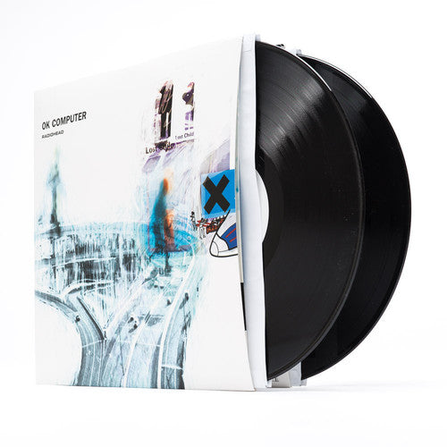 Album cover art for Radiohead's OK Computer, featuring a blurred, abstract depiction of a cityscape.
