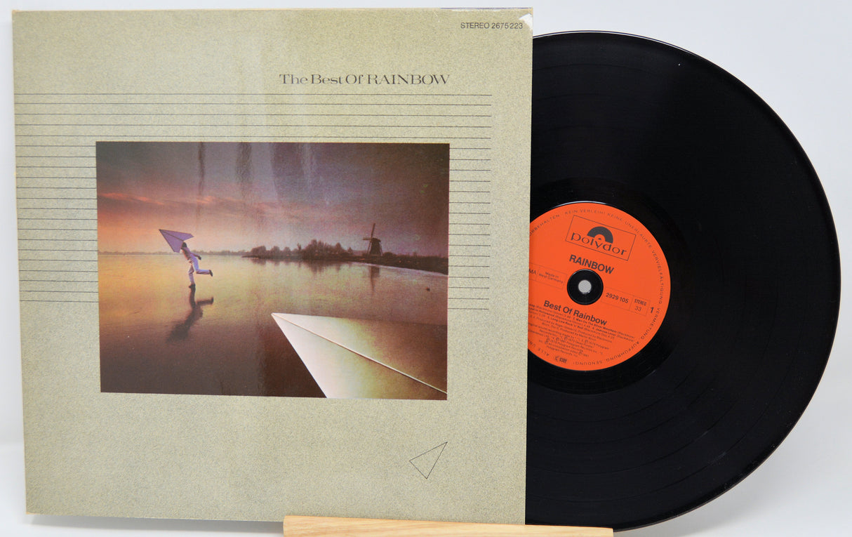 Vinyl record and cover with a scenic design on a white background
