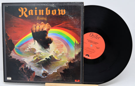 Vinyl record with cover featuring a dog and rainbow, titled 'Rainbow Rising'.
