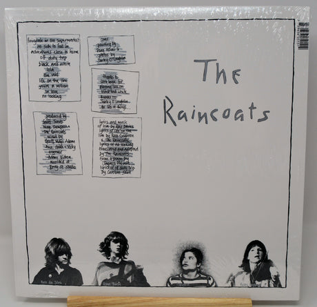 Vinyl record cover with text and black and white illustrations of four people on a gray background