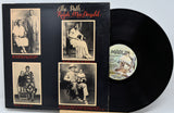 Vinyl record with black cover featuring black and white photos and 'Marlin' label.