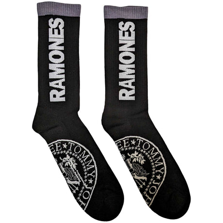 A pair of black ankle socks with the word 'RAMONES' printed in white on the side, featuring a 'Presidential Seal' design motif.