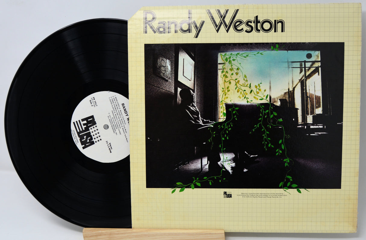 Vinyl record with cover featuring 'Randy Weston' on a light gray background